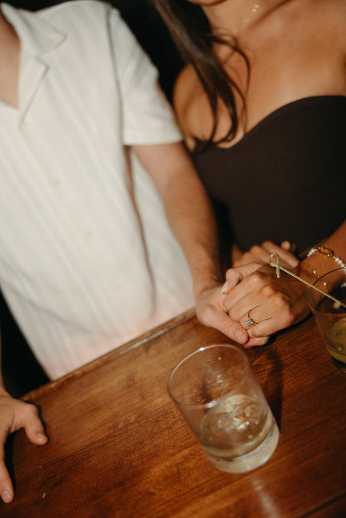 Couple enjoying drinks together during their bar engagement