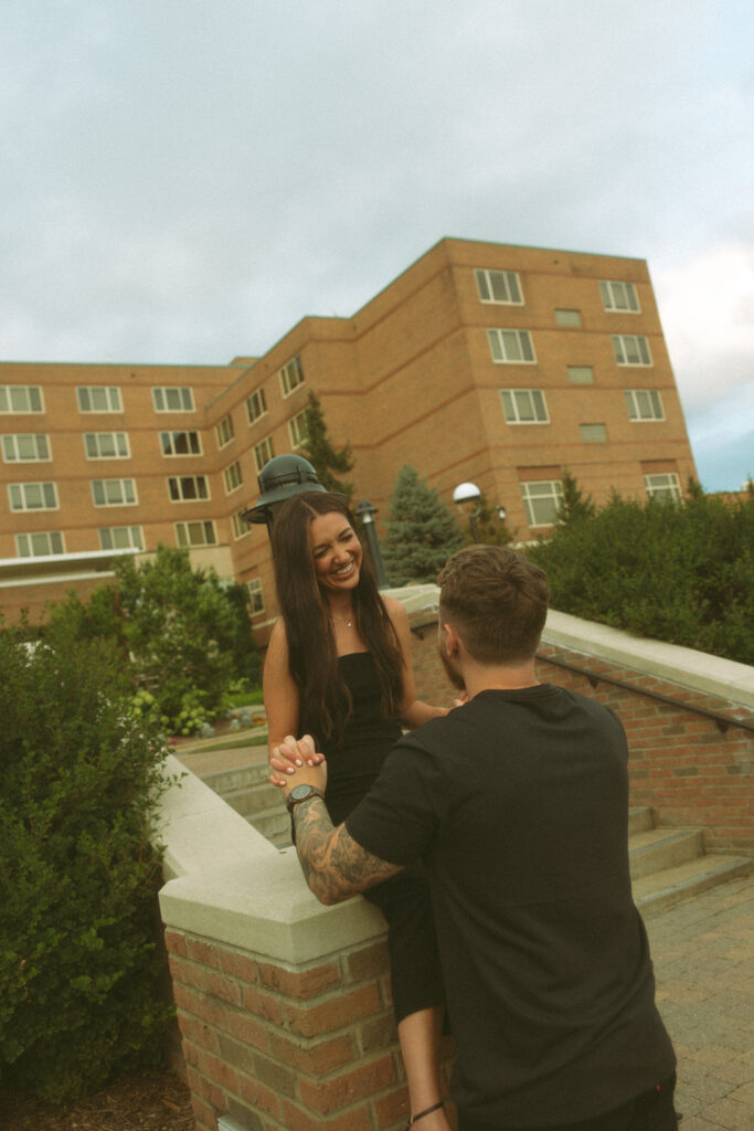 Man and woman being playful during their engagement