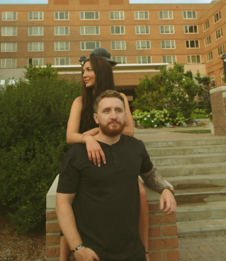 Couple posing for their downtown Midland engagement photos