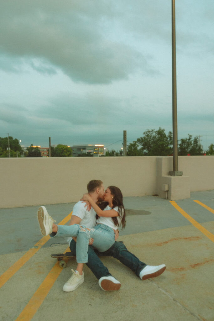 Couple kissing on a rooftop parking garage in Mid Michigan