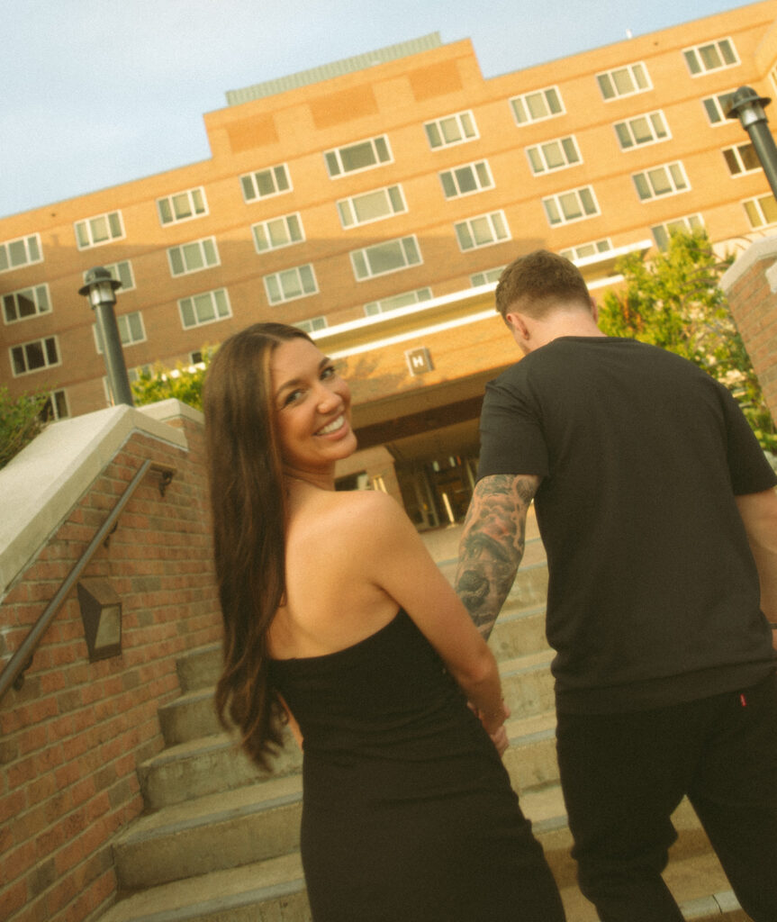 Woman smiling while looking at the camera for her Midland engagement photos