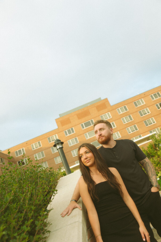 Man and woman looking away from the camera during their photo session