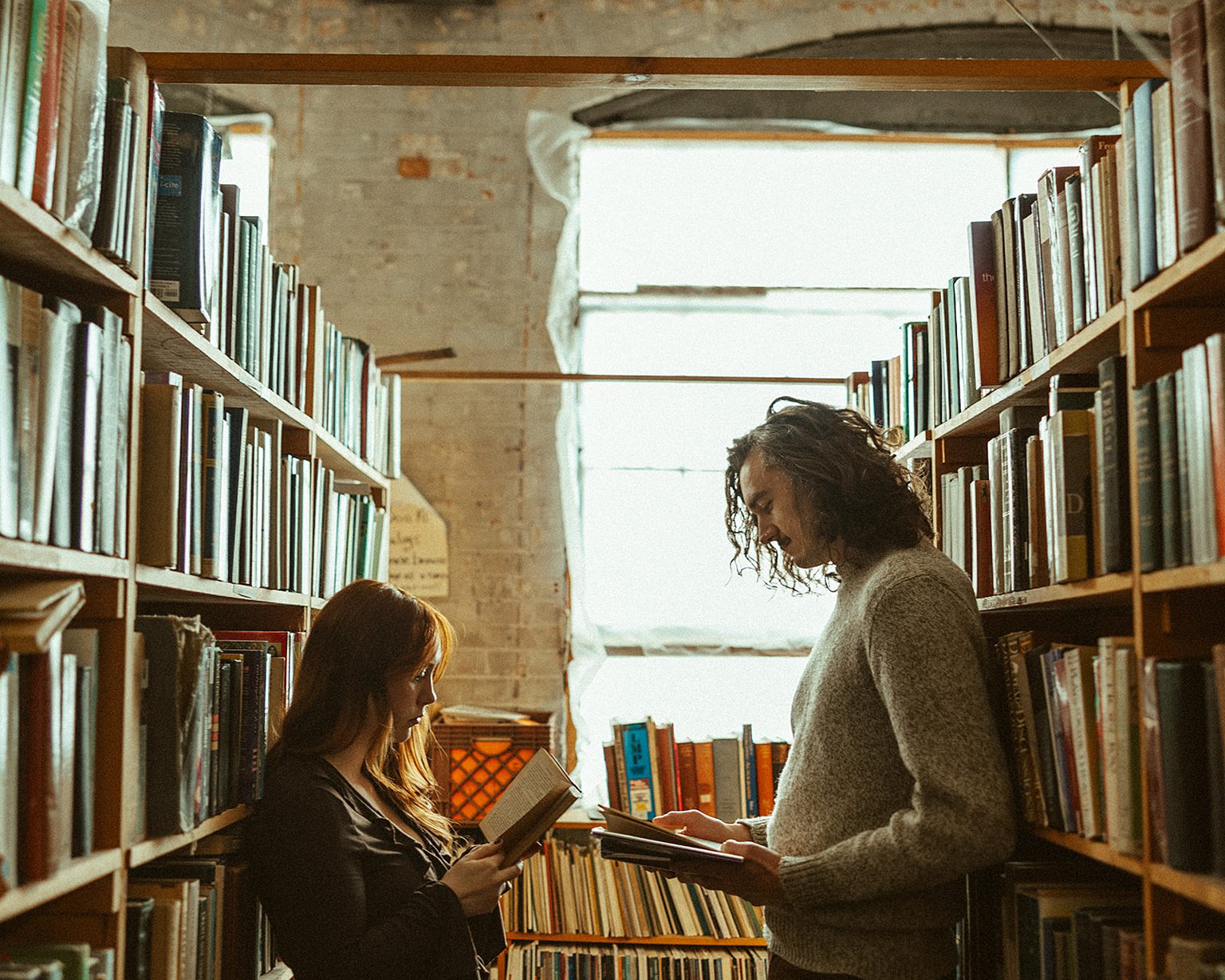 Couples Detroit engagement photos at John K. King Books