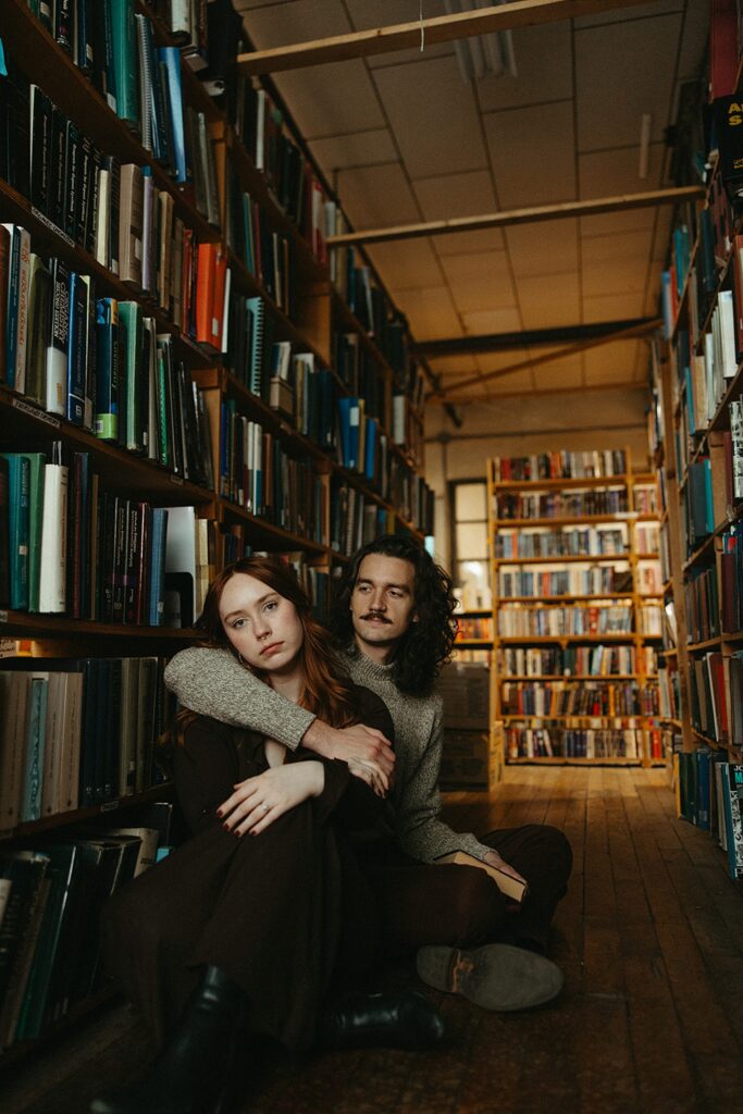 Couples Detroit engagement photos at John K. King Books