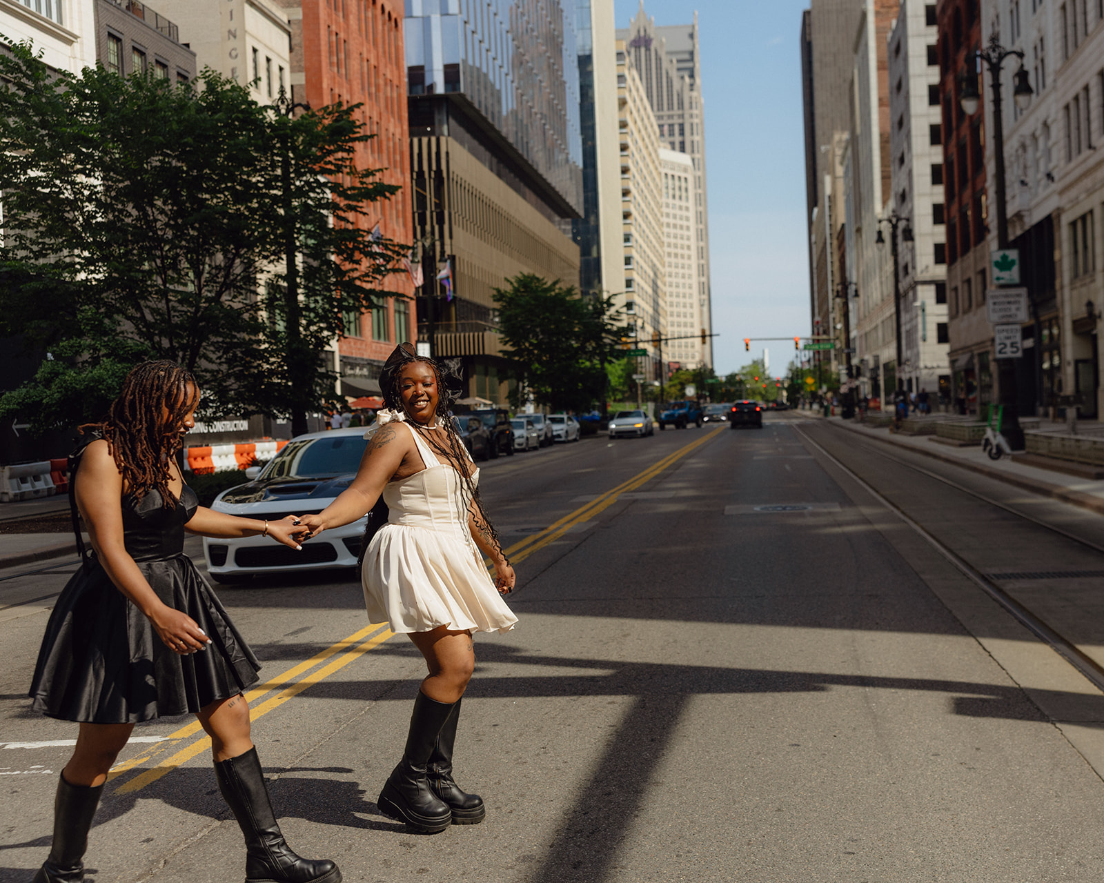 Couple walking in downtown Detroit for their engagement photos.