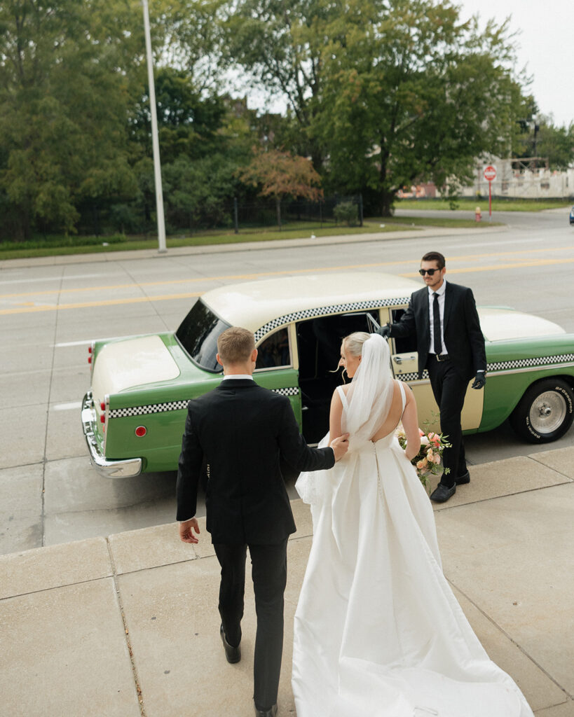 Couple getting into their Petrol Car Rental in Detroit, MI