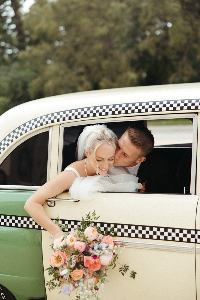 Couple posing in their vintage Petrol Car Rental in Detroit, MI