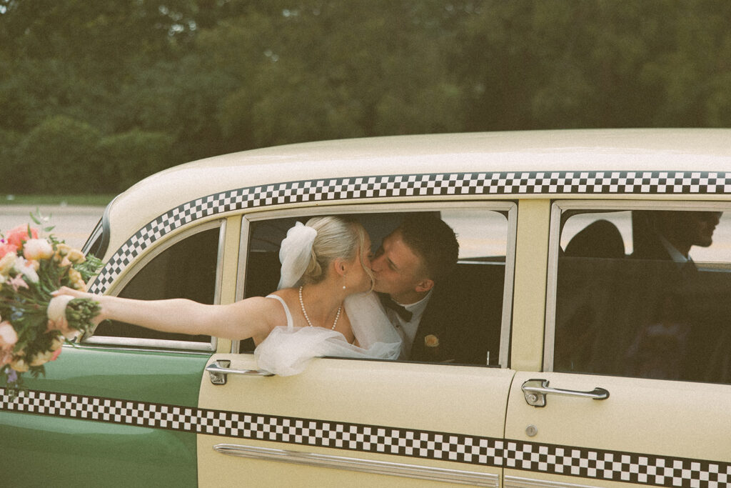 Couples kissing in a vintage Petrol Car in Detroit, MI