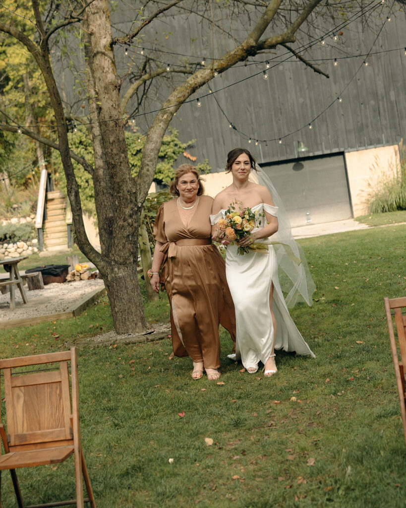 Bride being walked down the aisle