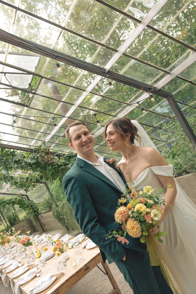 Bride and grooms Glass House Creative Community wedding reception room reveal in the greenhouse