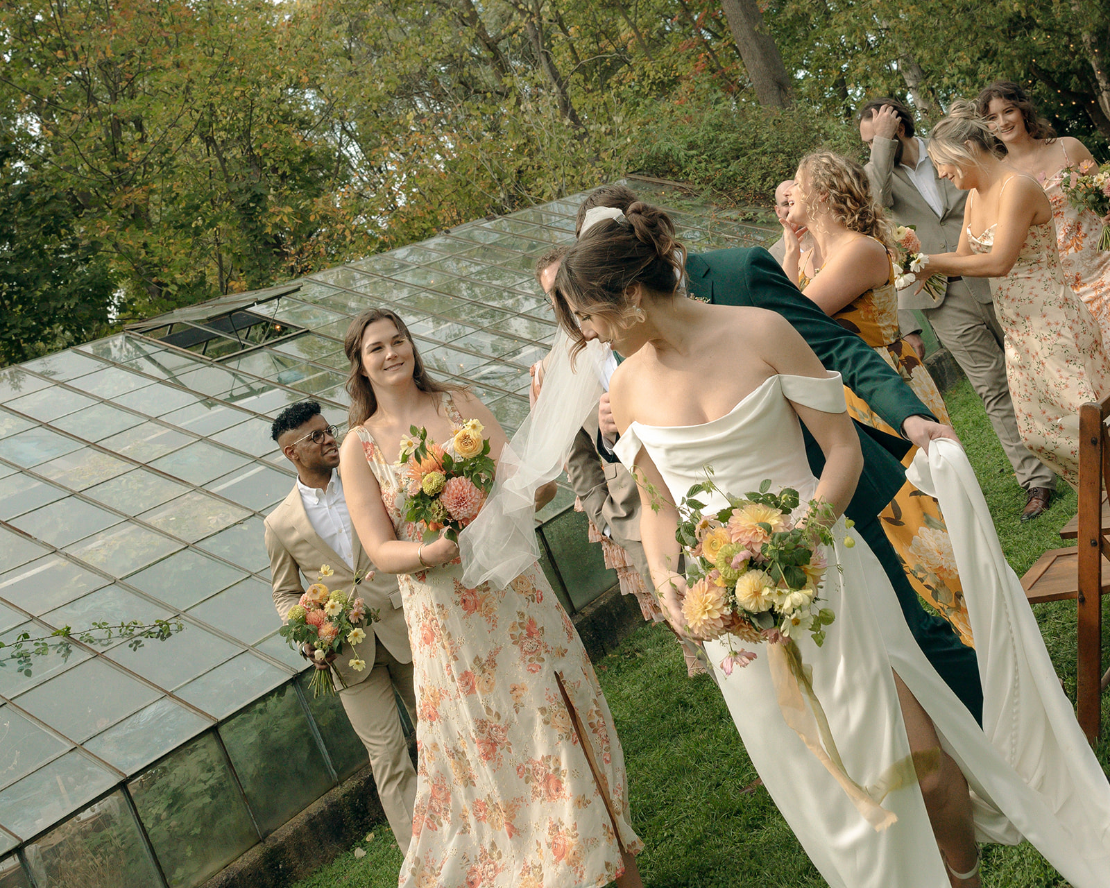 Outdoor documentary style wedding party photos at Glass House Creative Community in Zeeland, MI