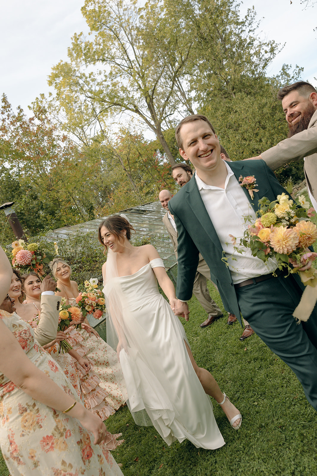 Outdoor documentary style wedding party photos at Glass House Creative Community in Zeeland, MI