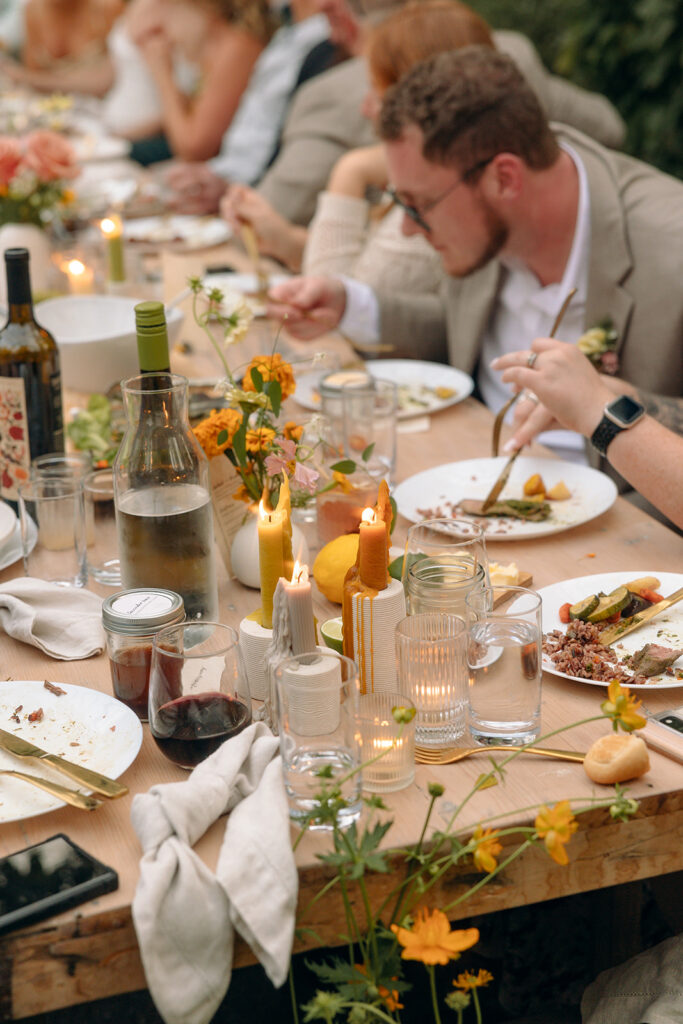 An indoor Glass House Creative Community wedding reception in the greenhouse 