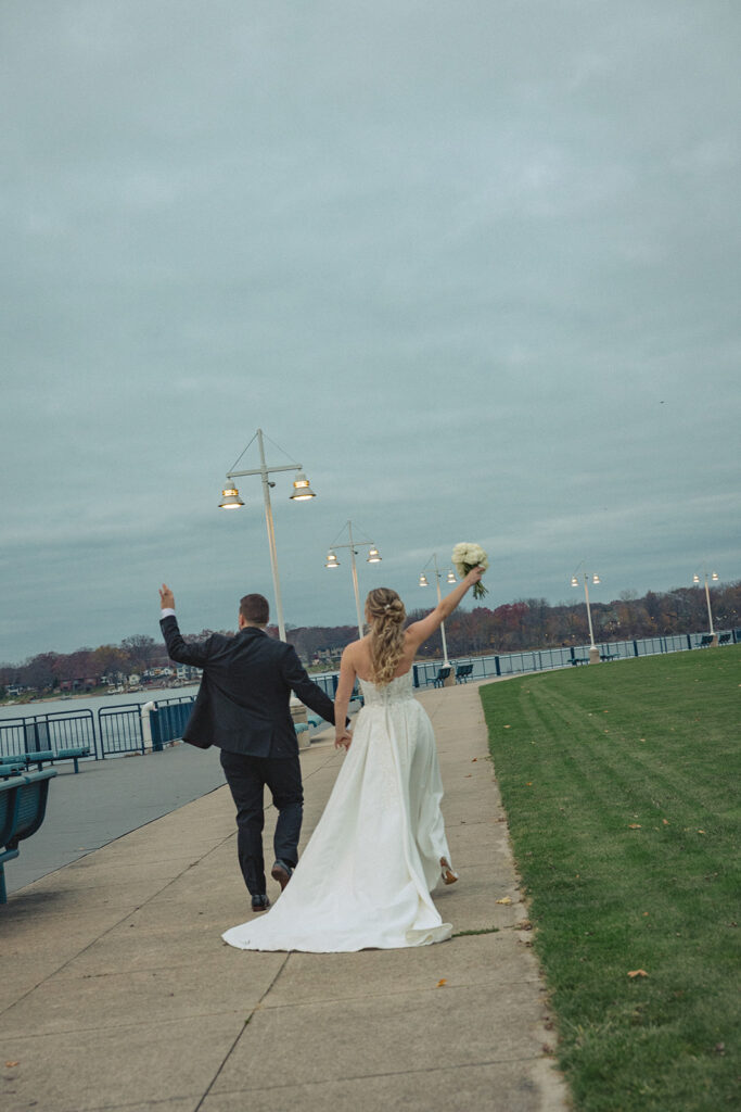 Bride and grooms Holland MI wedding portraits at Heinz waterfront walkway