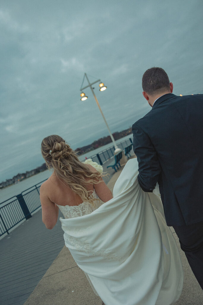 Bride and grooms Holland MI wedding portraits at Heinz waterfront walkway