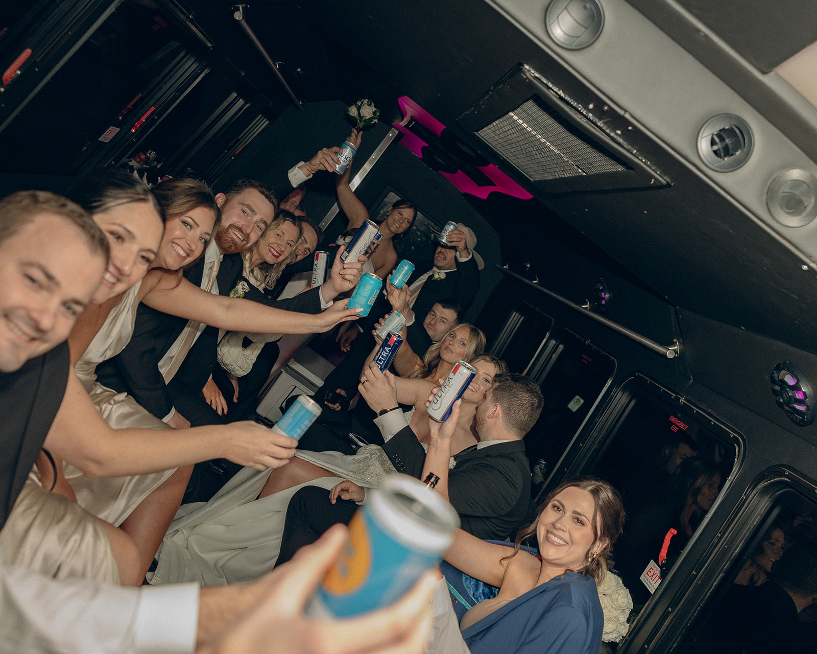 Wedding party on a party bus heading to the reception