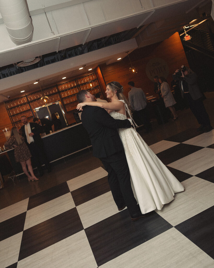 Bride and grooms first dance at Port 393 wedding venue in Holland, MI