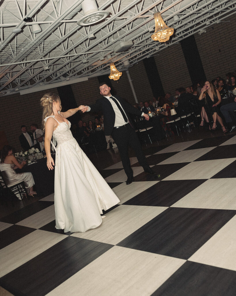 Bride and grooms first dance at Port 393 wedding venue in Holland, MI