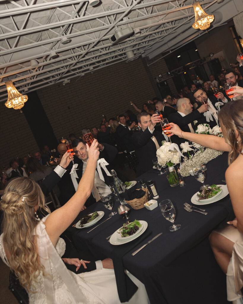 Guests toasting during speeches