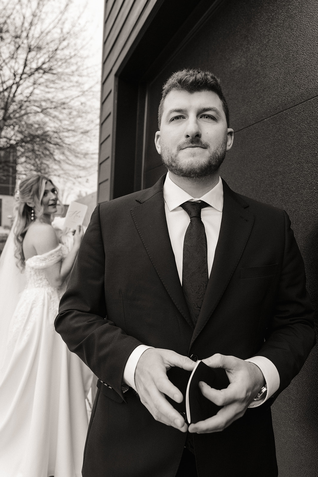 Black and white photo of a bride and groom during their private vows