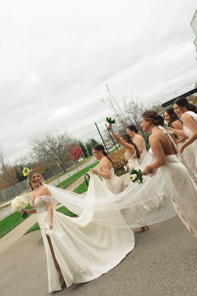 Candid bride and bridesmaids portraits from a Holland, MI wedding