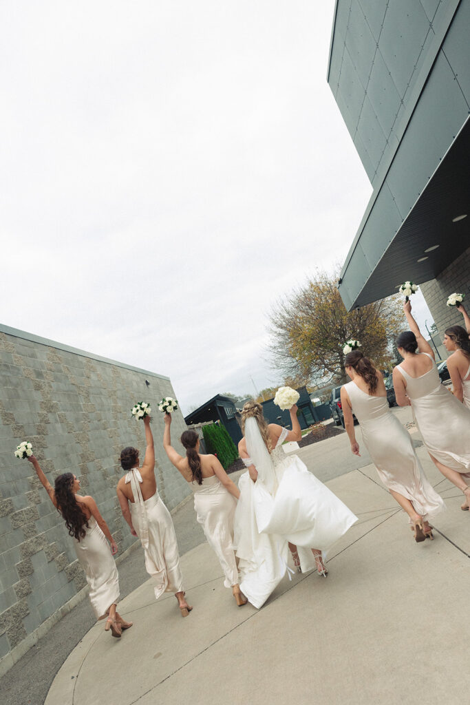 Candid bride and bridesmaids portraits from a Holland, MI wedding