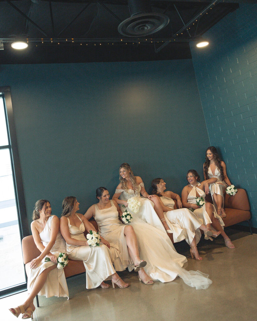 Bride and bridesmaids indoor Port 393 wedding portraits in Holland, MI