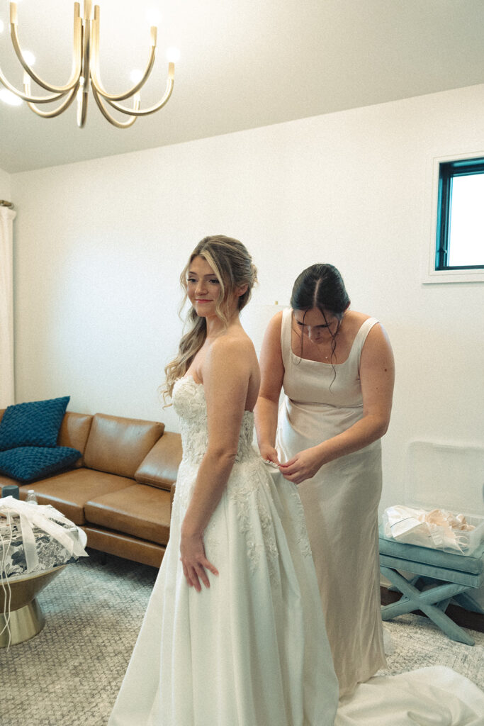 Bride getting her dress on