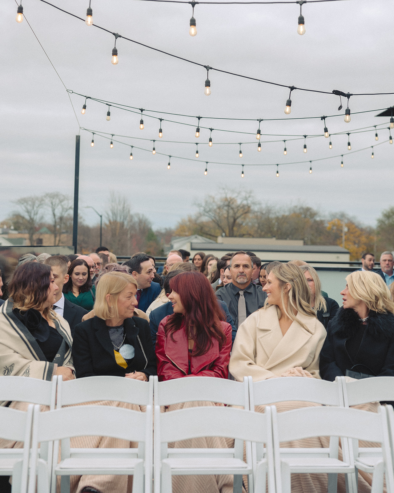 Guests sitting for a Port 393 wedding ceremony in Holland, MI