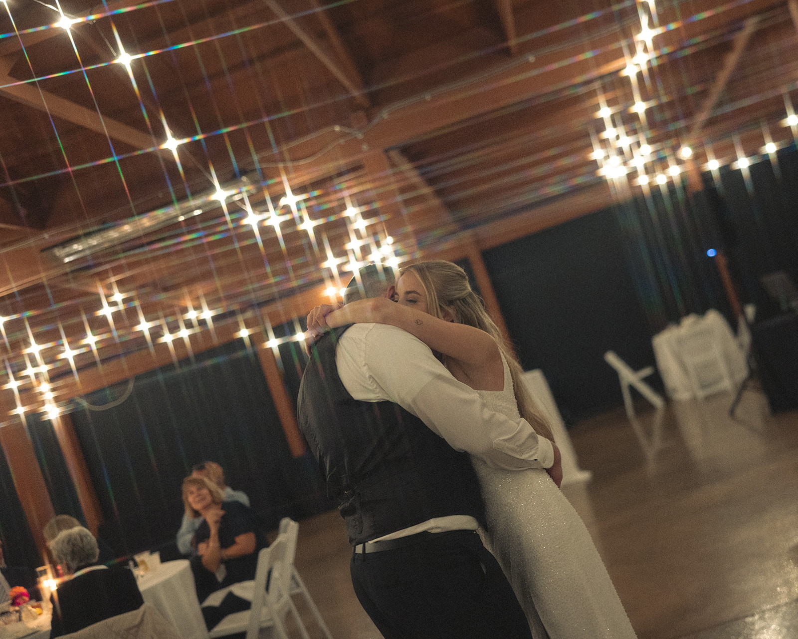 Bride and groom sharing a first dance in The Summerhouse at Fox Hills Golf Course