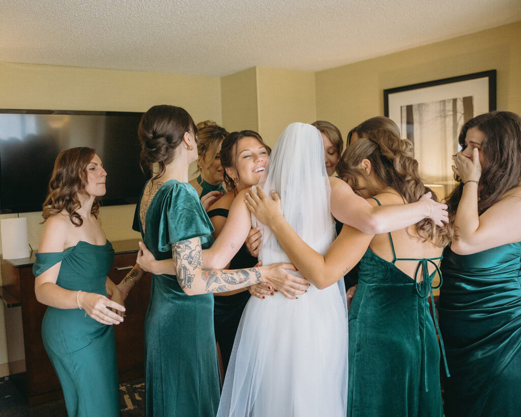 Bride and bridesmaids sharing a first look