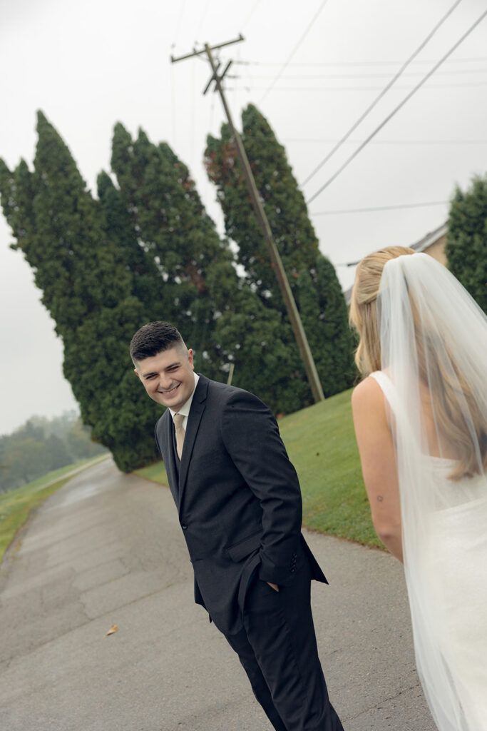 Bride and groom sharing a first look outside of Fox Hills Golf Club - Greater Detroit wedding venue
