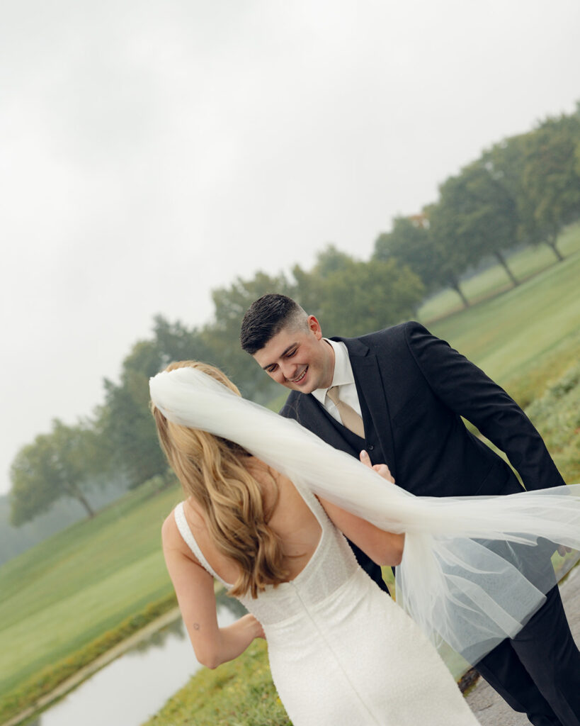 Bride and groom sharing a first look outside of Fox Hills Golf Club - Greater Detroit wedding venue