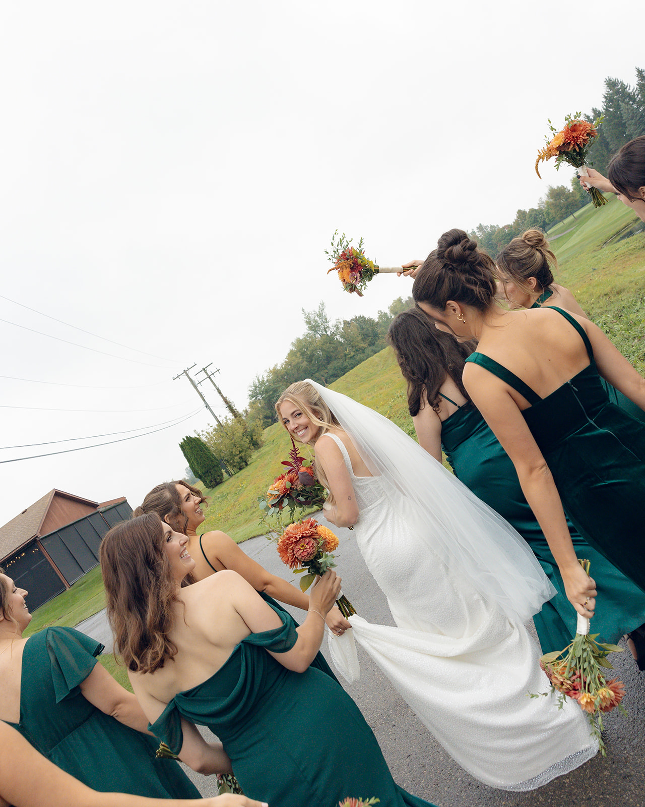 Rainy outdoor bride and bridesmaids photos at Fox Hill Golf Club - Greater Detroit wedding venue