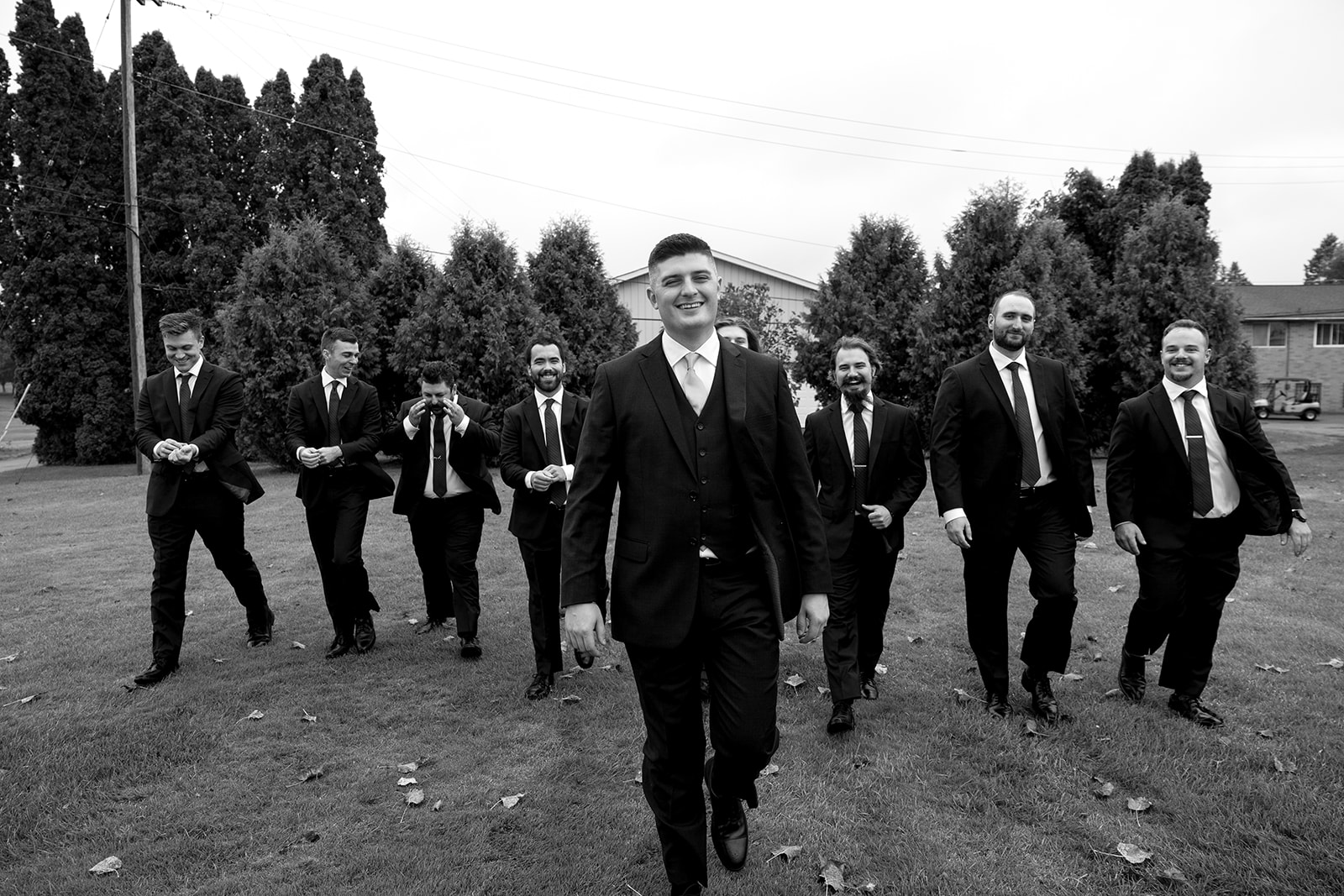 Rainy outdoor groom and groomsmen photos at Fox Hill Golf Club - Greater Detroit wedding venue