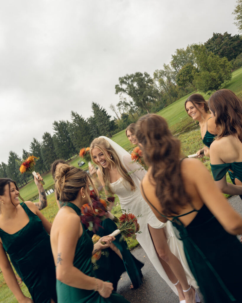 Rainy outdoor bride and bridesmaids photos at Fox Hill Golf Club - Greater Detroit wedding venue