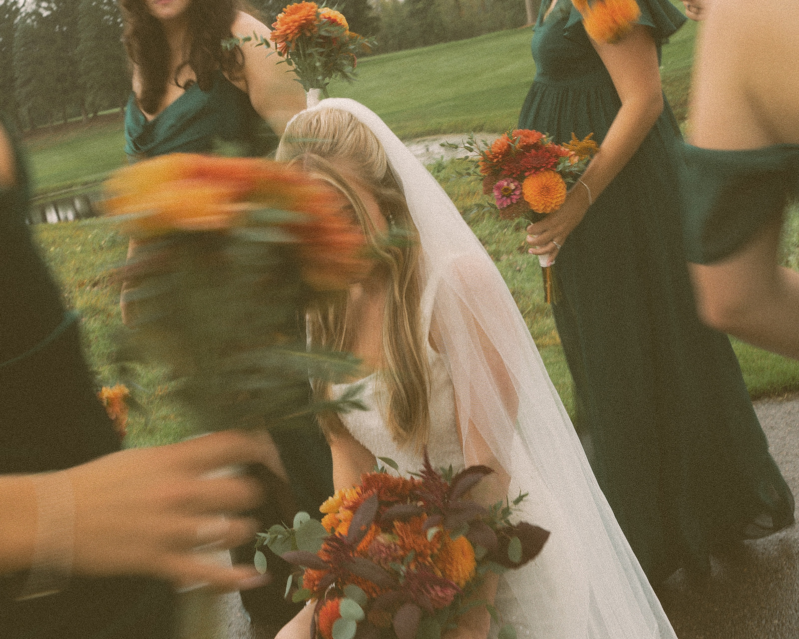 Rainy outdoor bride and bridesmaids photos at Fox Hill Golf Club - Greater Detroit wedding venue