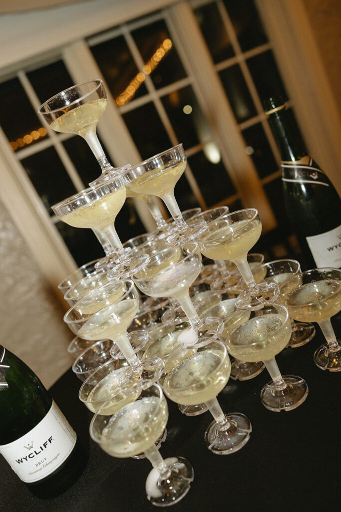 Champagne tower setup at the wedding reception, ready for the pour