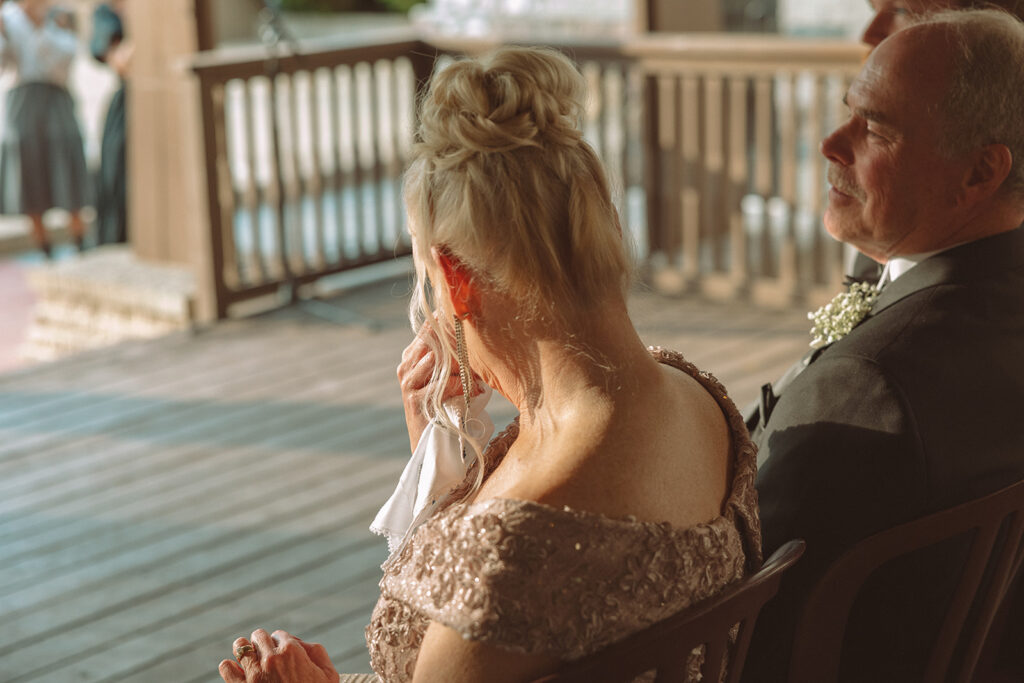 Mother of the groom getting emotional during the ceremony
