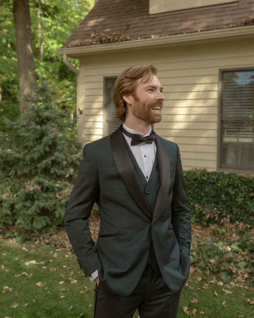 Outdoor grooms portraits from a Pine Knob Mansion wedding
