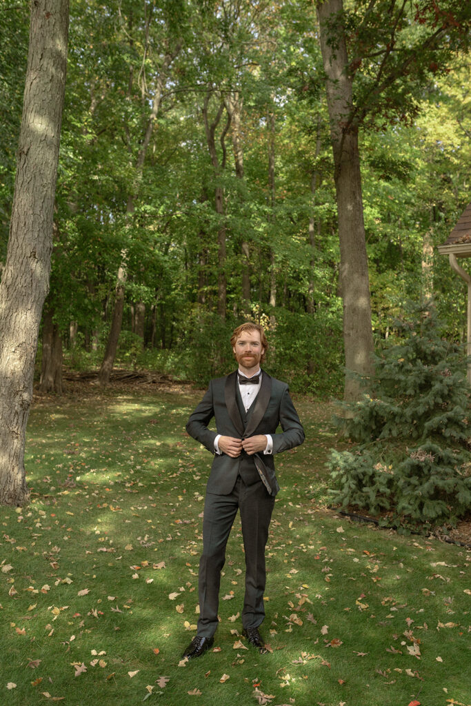 Outdoor grooms portraits from a Pine Knob Mansion wedding