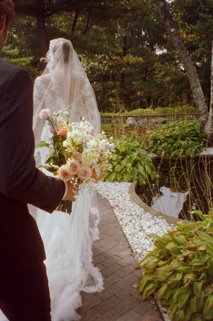 Outdoor bride and grooms portraits on film from a Pine Knob Mansion wedding in Clarkston, MI