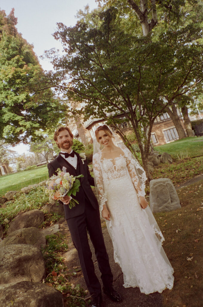 Bride and grooms Pine Knob Mansion wedding portraits outside