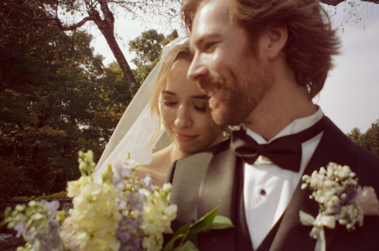 Outdoor bride and grooms portraits on film from a Pine Knob Mansion wedding in Clarkston, MI