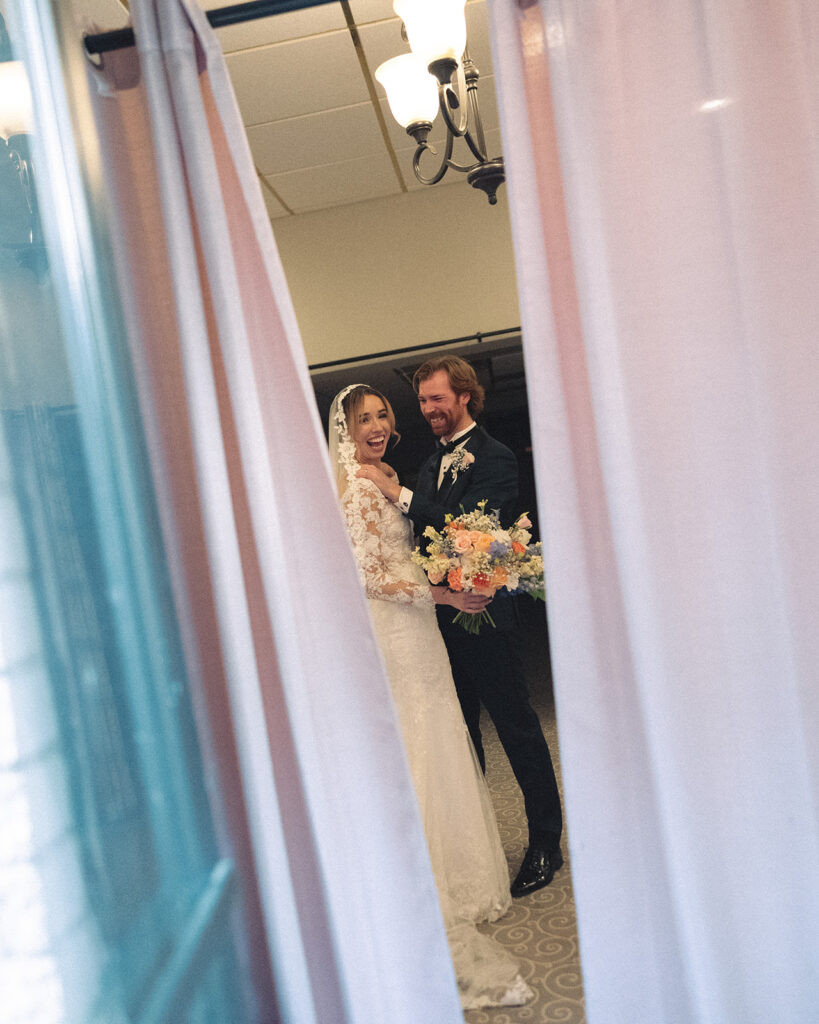Bride and groom smiling after their wedding ceremony