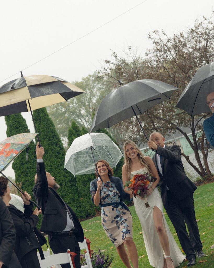 Bride being walked down the aisle by her parents