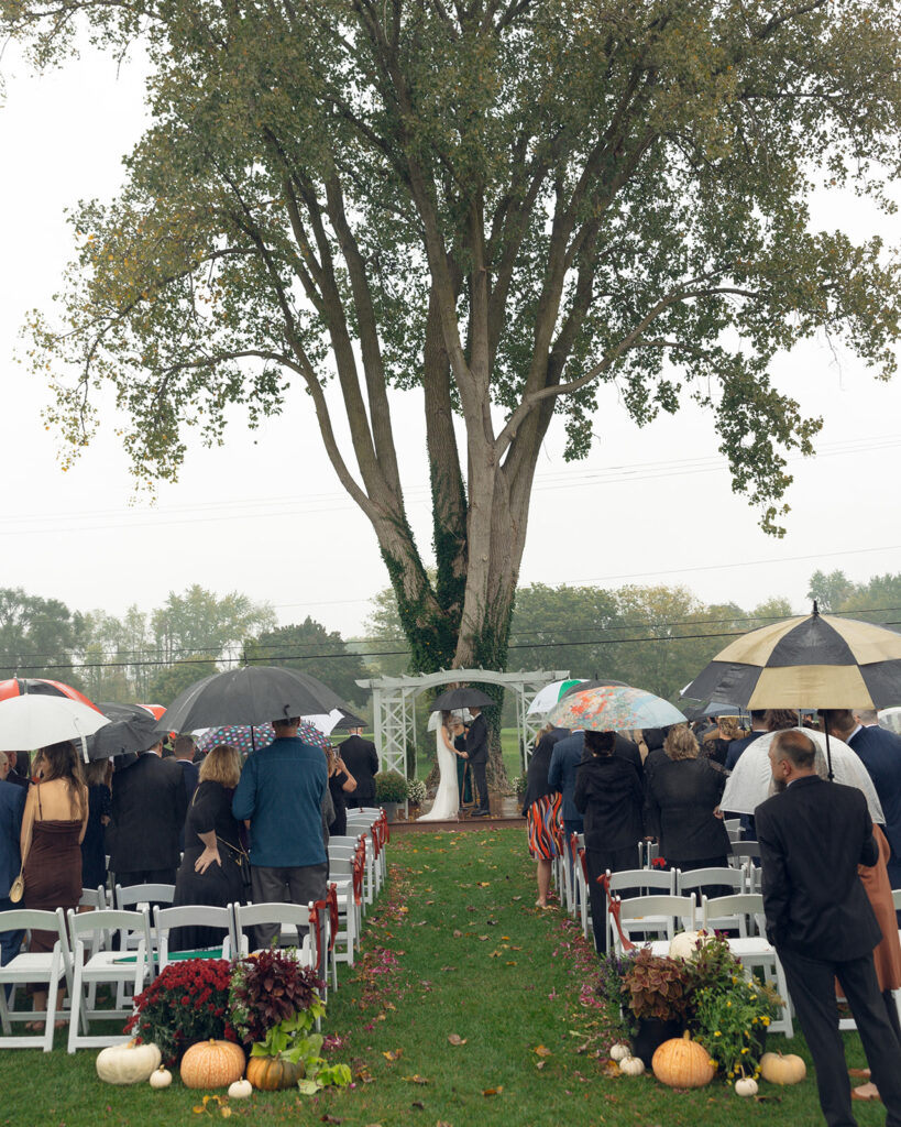 Rainy outdoor Fox Hill Golf Club wedding ceremony in greater Detroit
