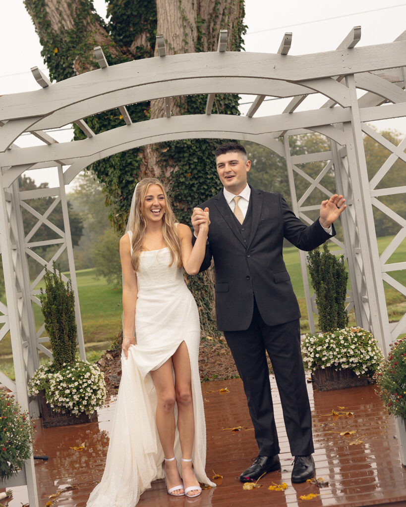 Rainy outdoor Fox Hill Golf Club wedding ceremony in greater Detroit