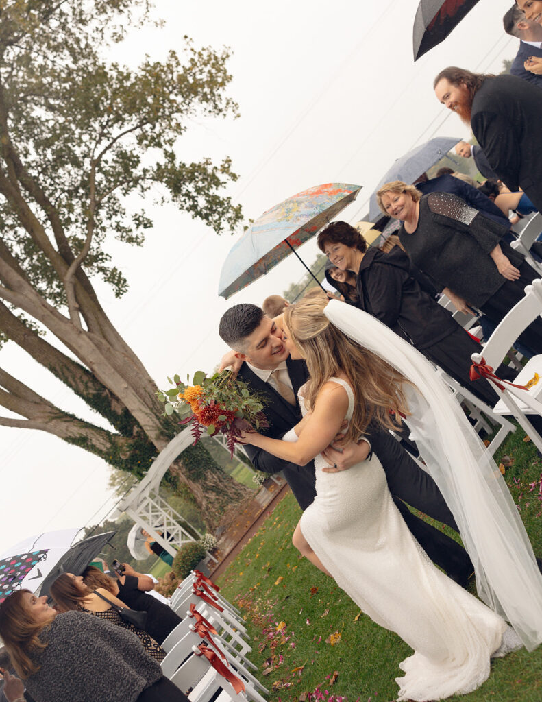 Rainy outdoor Fox Hill Golf Club wedding ceremony in greater Detroit