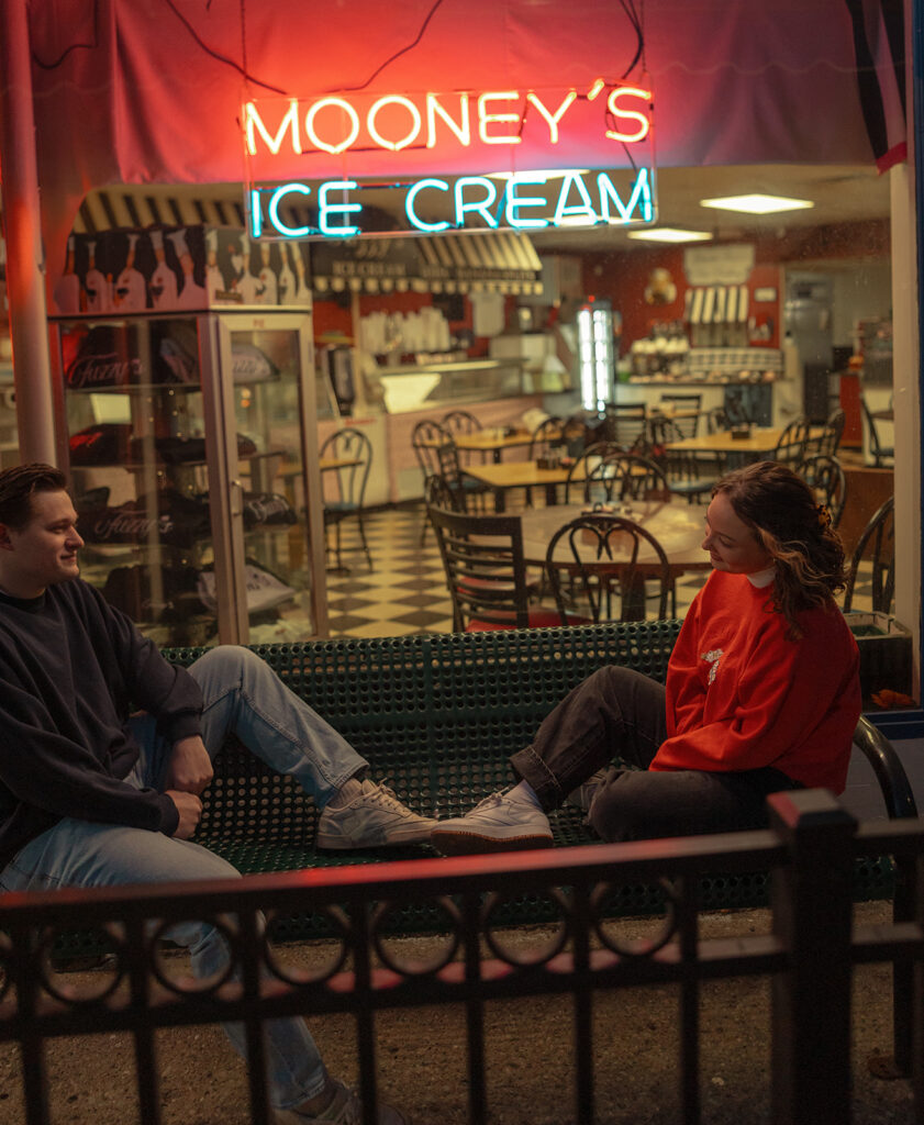 Couples laid-back Mooney's Ice Cream shop engagement photos in Michigan